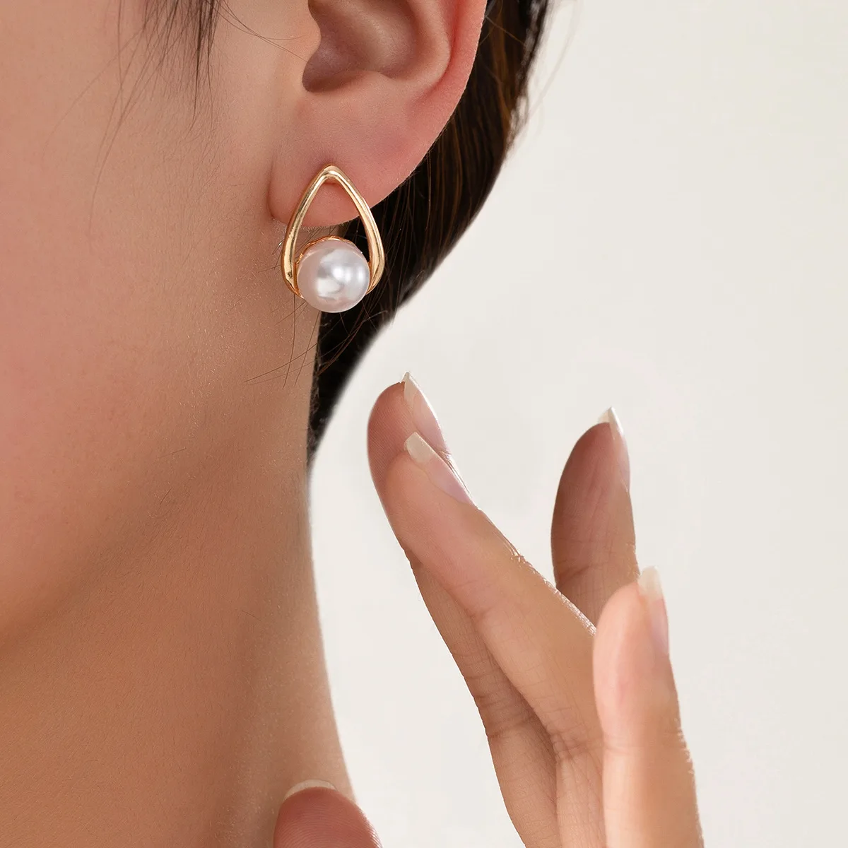 Minimalistic V Pearl Stud Earrings - Image 3