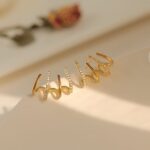 golden claw earrings